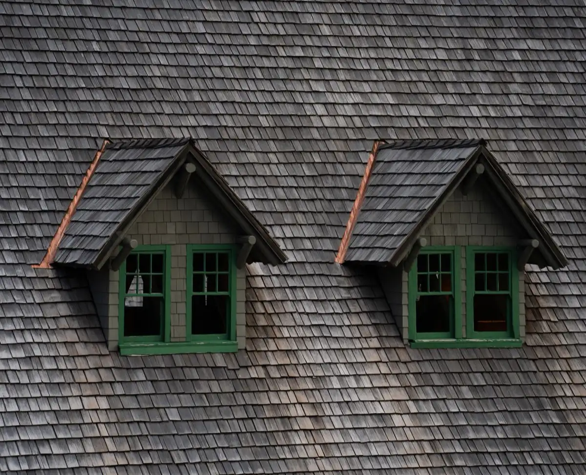 Dormers on a shingle roof in Brownwood, TX, where step flashing and kickout flashing carry water past the walls